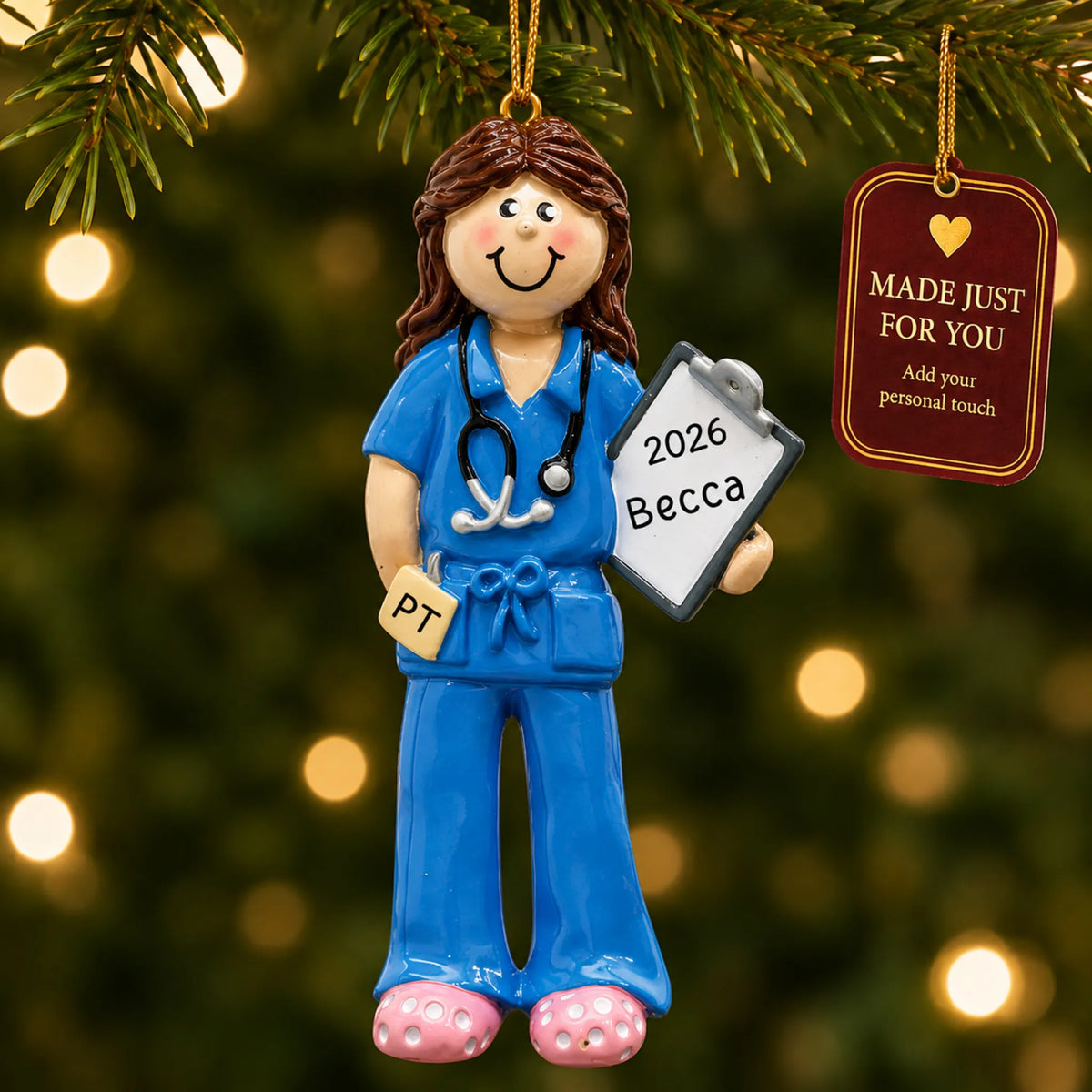 Physical therapist christmas ornament hanging on a lit Christmas tree with a Made Just For You gift tag