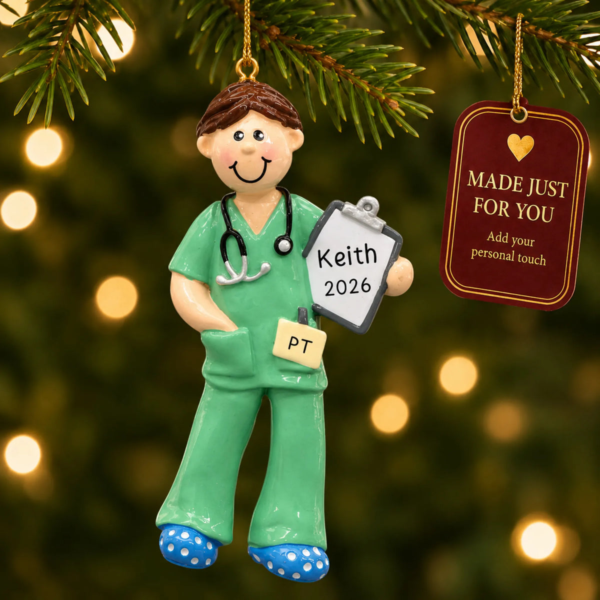 Physical therapist guy christmas ornament hanging on a lit Christmas tree with a Made Just For You gift tag