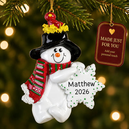 Birdsnest Snowman christmas ornament hanging on a lit Christmas tree with a Made Just For You gift tag