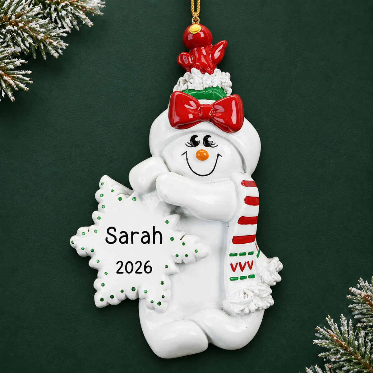 Personalized Birdsnest Snow Woman christmas ornament on a dark green pine background