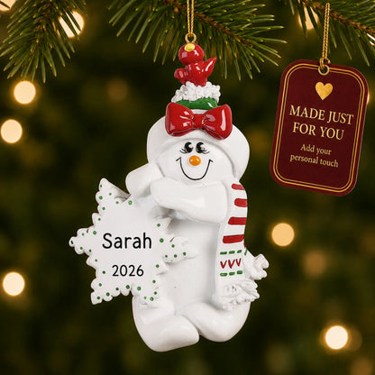 Birdsnest Snow Woman christmas ornament hanging on a lit Christmas tree with a Made Just For You gift tag