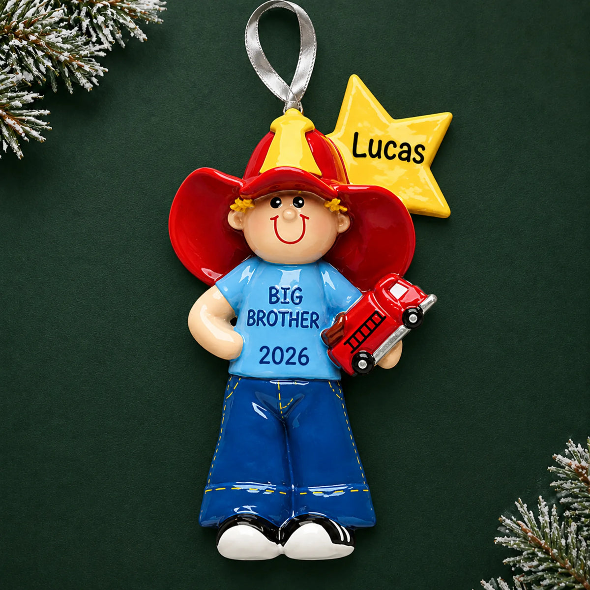 Personalized big brother firefighter christmas ornament on a dark green pine background