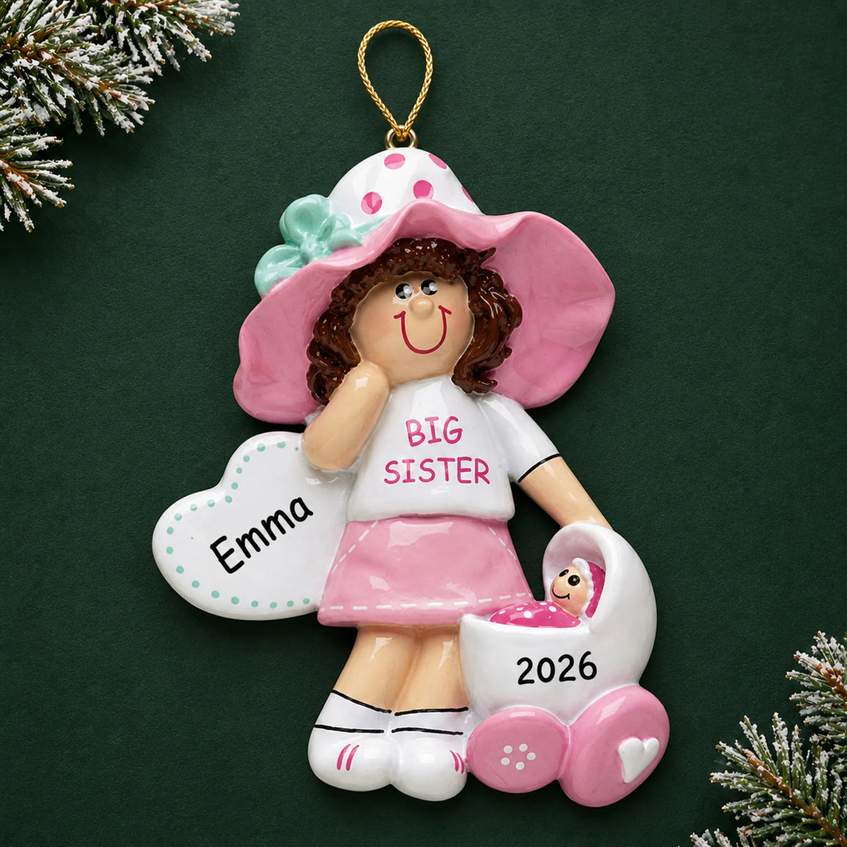 Personalized brunette big sister christmas ornament on a dark green pine background