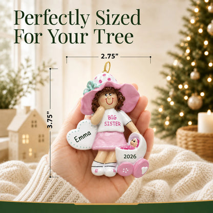 Size guide: the personalized brunette big sister christmas ornament is 2.75 in wide by 3.75 in tall, shown in hand