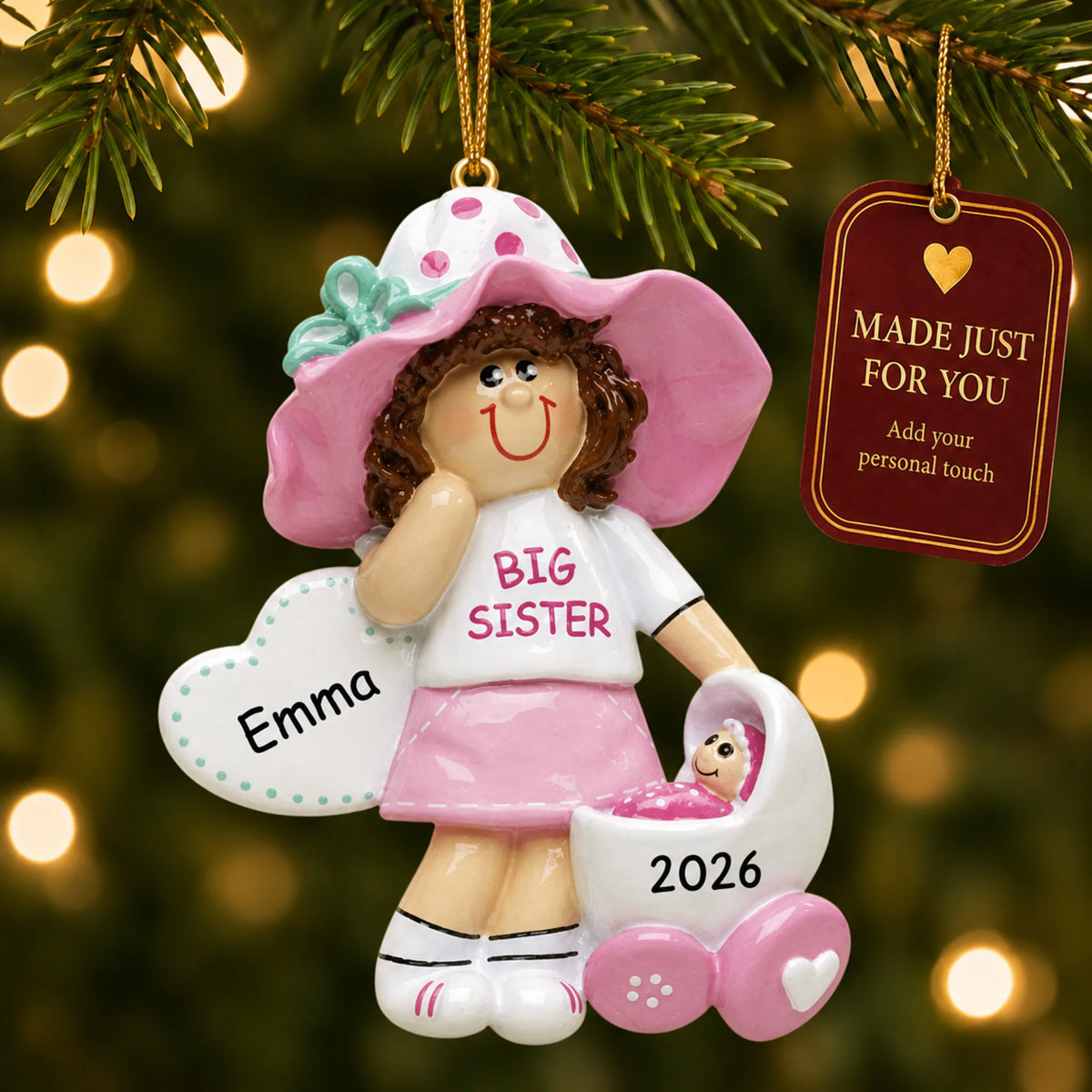 Brunette big sister christmas ornament hanging on a lit Christmas tree with a Made Just For You gift tag