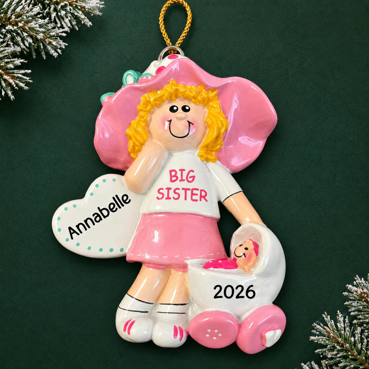 Personalized blonde big sister christmas ornament on a dark green pine background