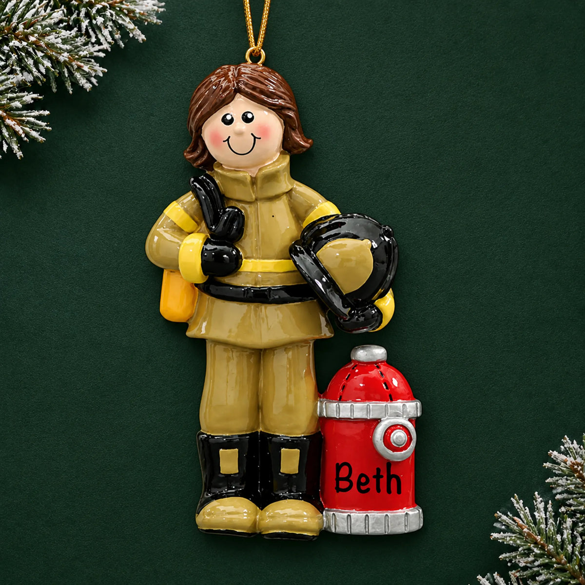 Personalized firefighter woman christmas ornament on a dark green pine background
