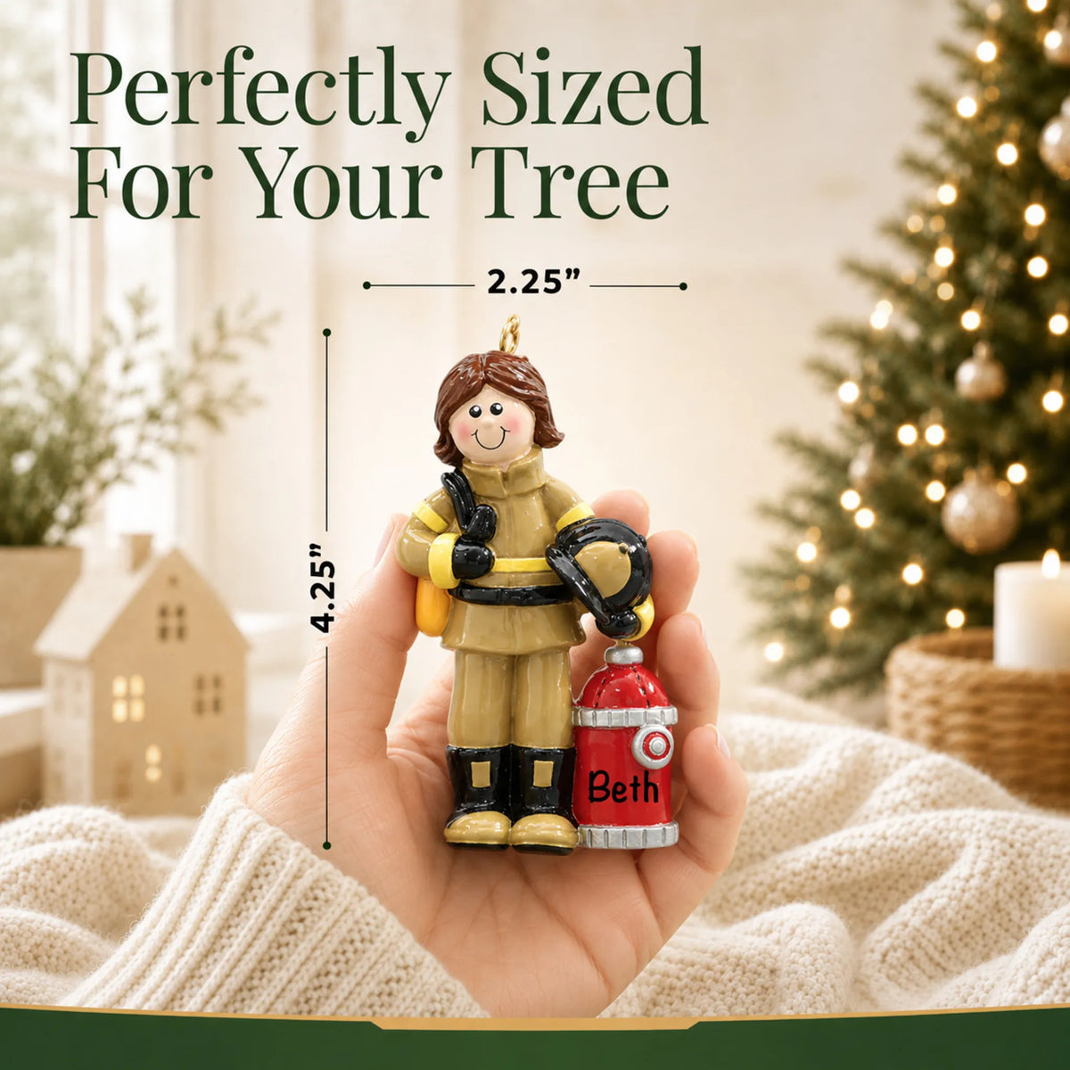 Size guide: the personalized firefighter woman christmas ornament is 2.25 in wide by 4.25 in tall, shown in hand