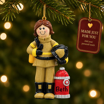 Firefighter woman christmas ornament hanging on a lit Christmas tree with a Made Just For You gift tag