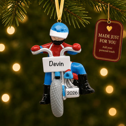Dirt bike rider christmas ornament hanging on a lit Christmas tree with a Made Just For You gift tag