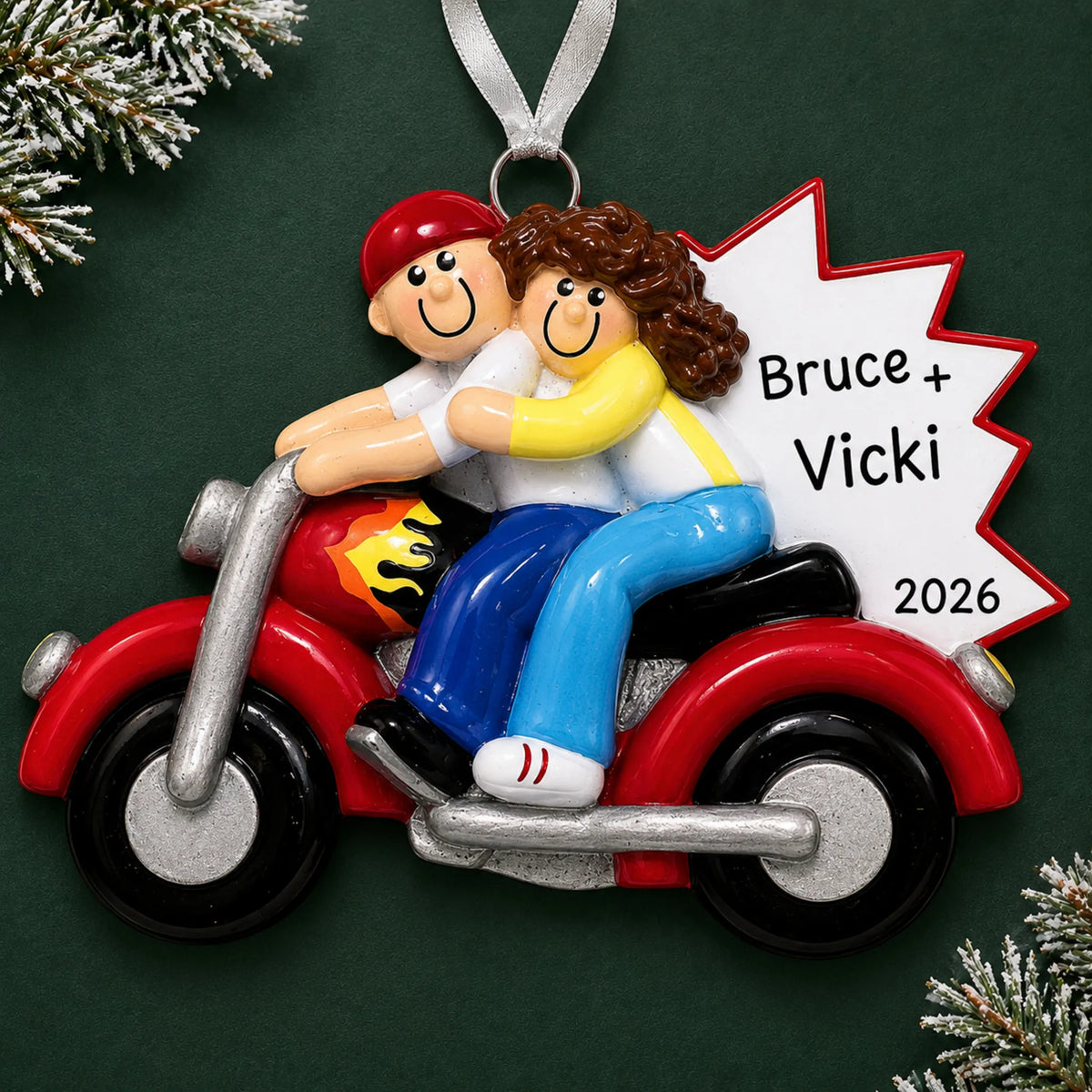 Personalized motorcycle couple christmas ornament on a dark green pine background