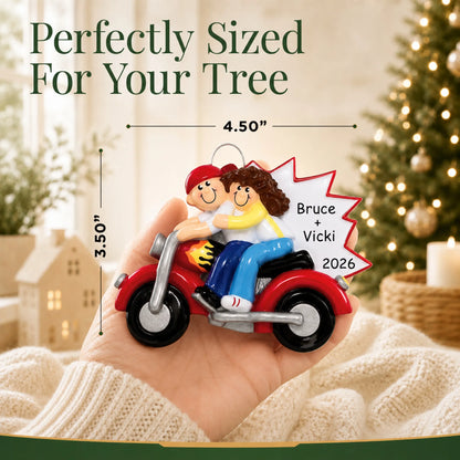 Size guide: the personalized motorcycle couple christmas ornament is 4.50 in wide by 3.50 in tall, shown in hand