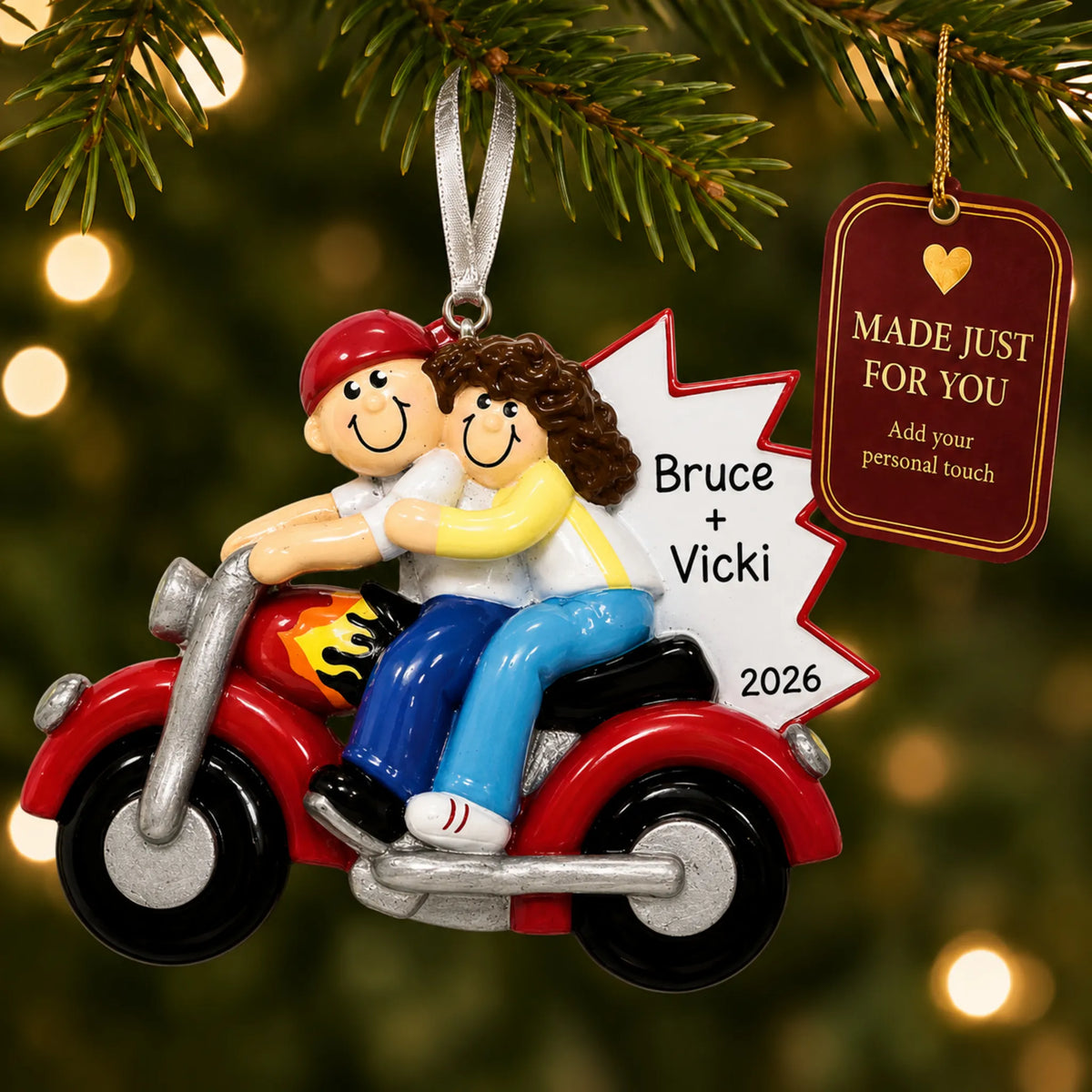 Motorcycle couple christmas ornament hanging on a lit Christmas tree with a Made Just For You gift tag