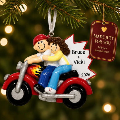 Motorcycle couple christmas ornament hanging on a lit Christmas tree with a Made Just For You gift tag