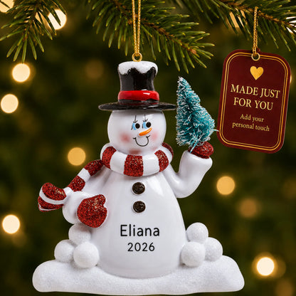 Snowman with Tree christmas ornament hanging on a lit Christmas tree with a Made Just For You gift tag