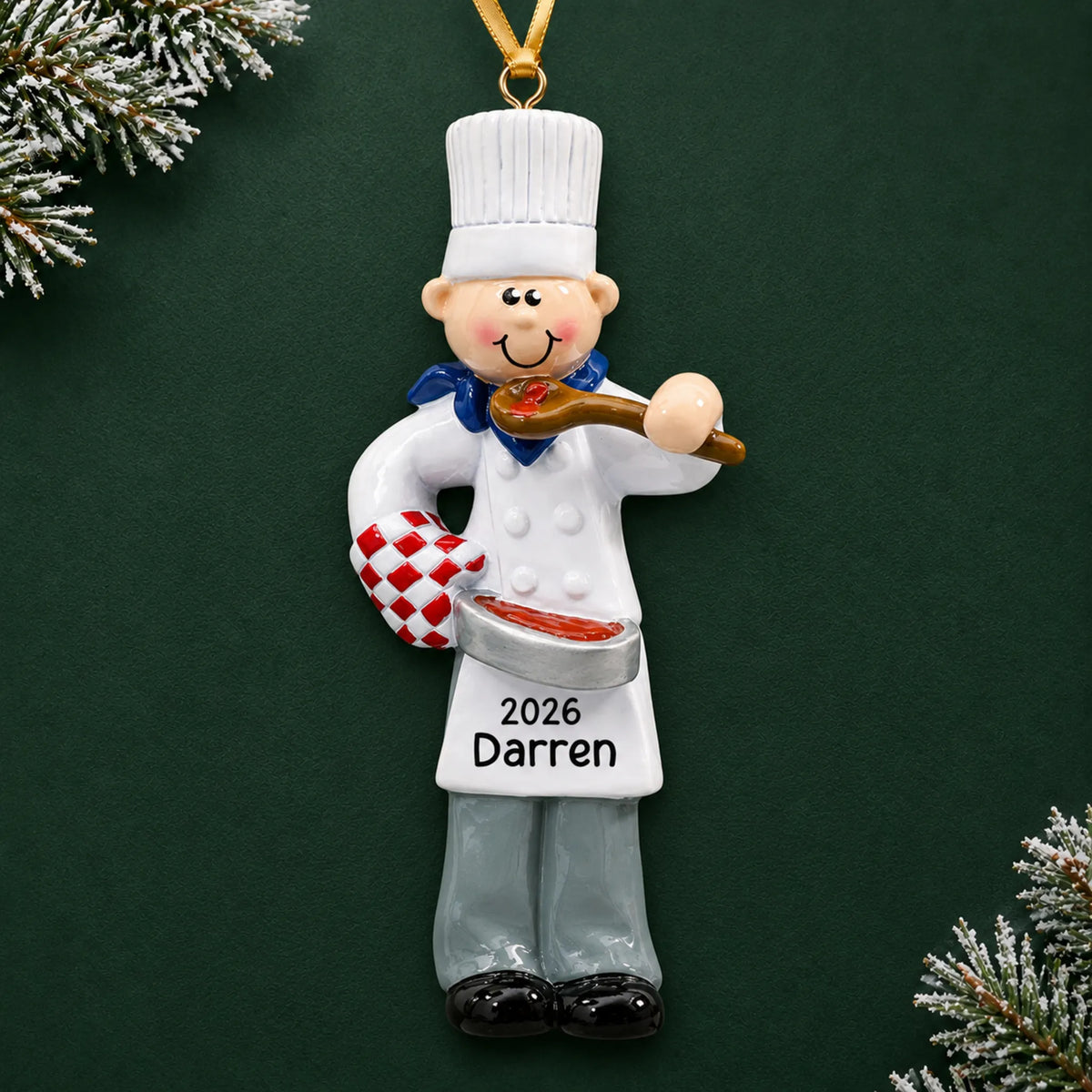 Personalized chef guy christmas ornament on a dark green pine background