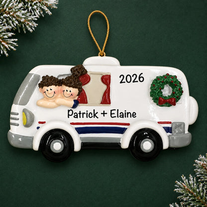 Personalized RV camping couple christmas ornament on a dark green pine background