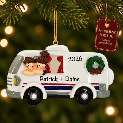 RV camping couple christmas ornament hanging on a lit Christmas tree with a Made Just For You gift tag