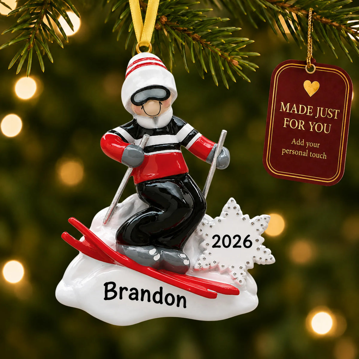 Ski guy christmas ornament hanging on a lit Christmas tree with a Made Just For You gift tag