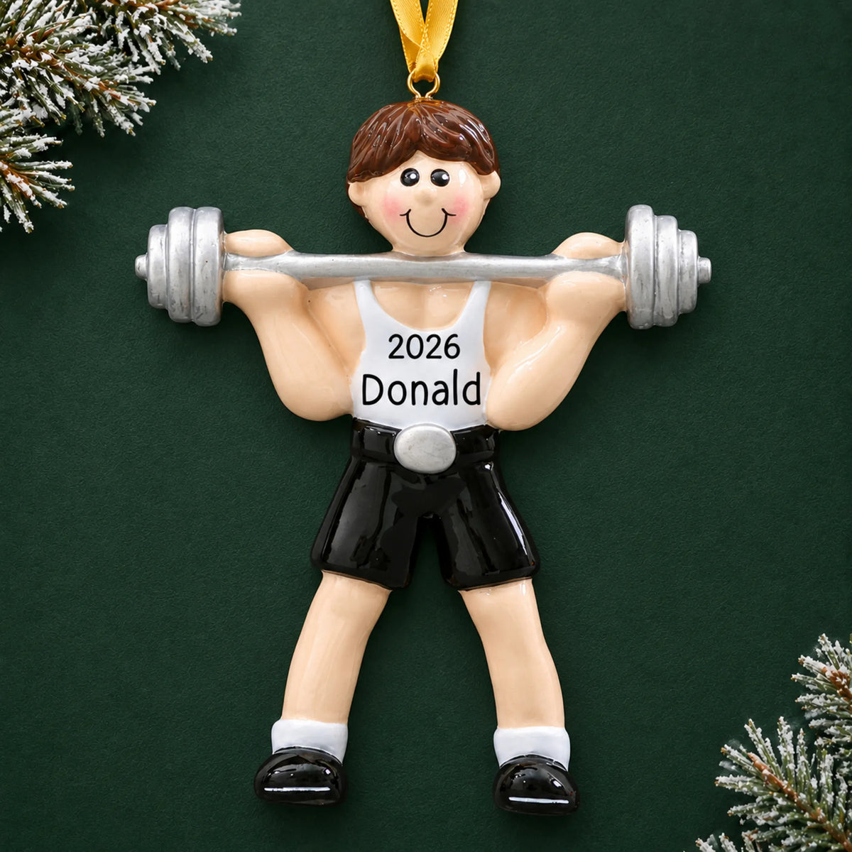 Personalized weightlifter christmas ornament on a dark green pine background
