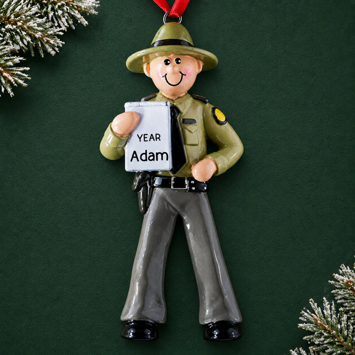 Personalized state trooper christmas ornament on a dark green pine background