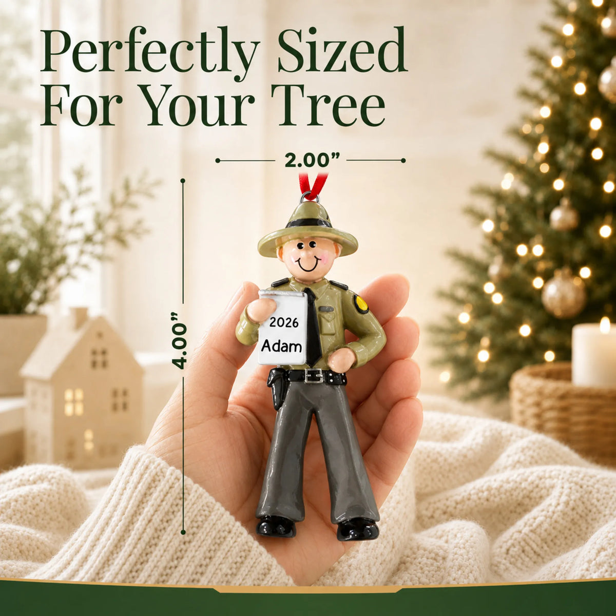Size guide: the personalized state trooper christmas ornament is 2.00 in wide by 4.00 in tall, shown in hand