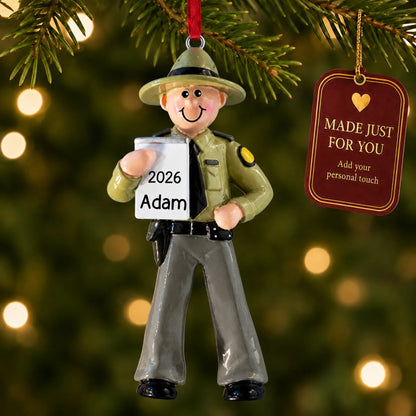 State trooper christmas ornament hanging on a lit Christmas tree with a Made Just For You gift tag