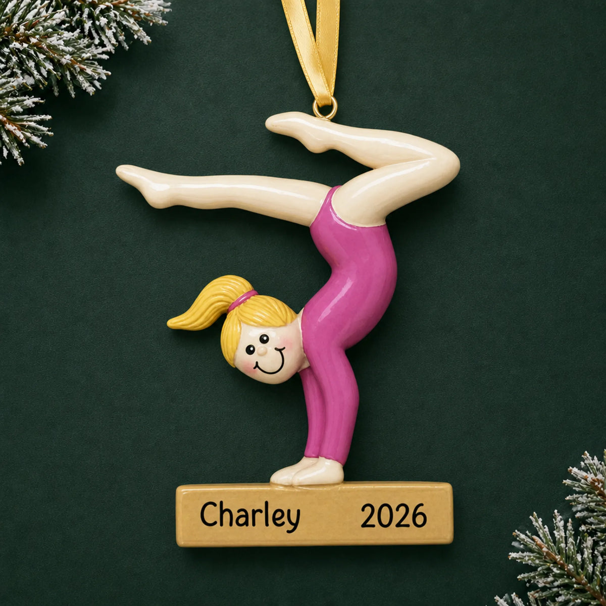 Personalized blonde gymnast balance beam christmas ornament on a dark green pine background