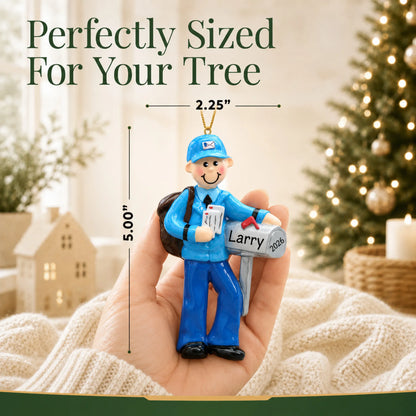 Size guide: the personalized postal mail carrier christmas ornament is 2.25 in wide by 5.00 in tall, shown in hand