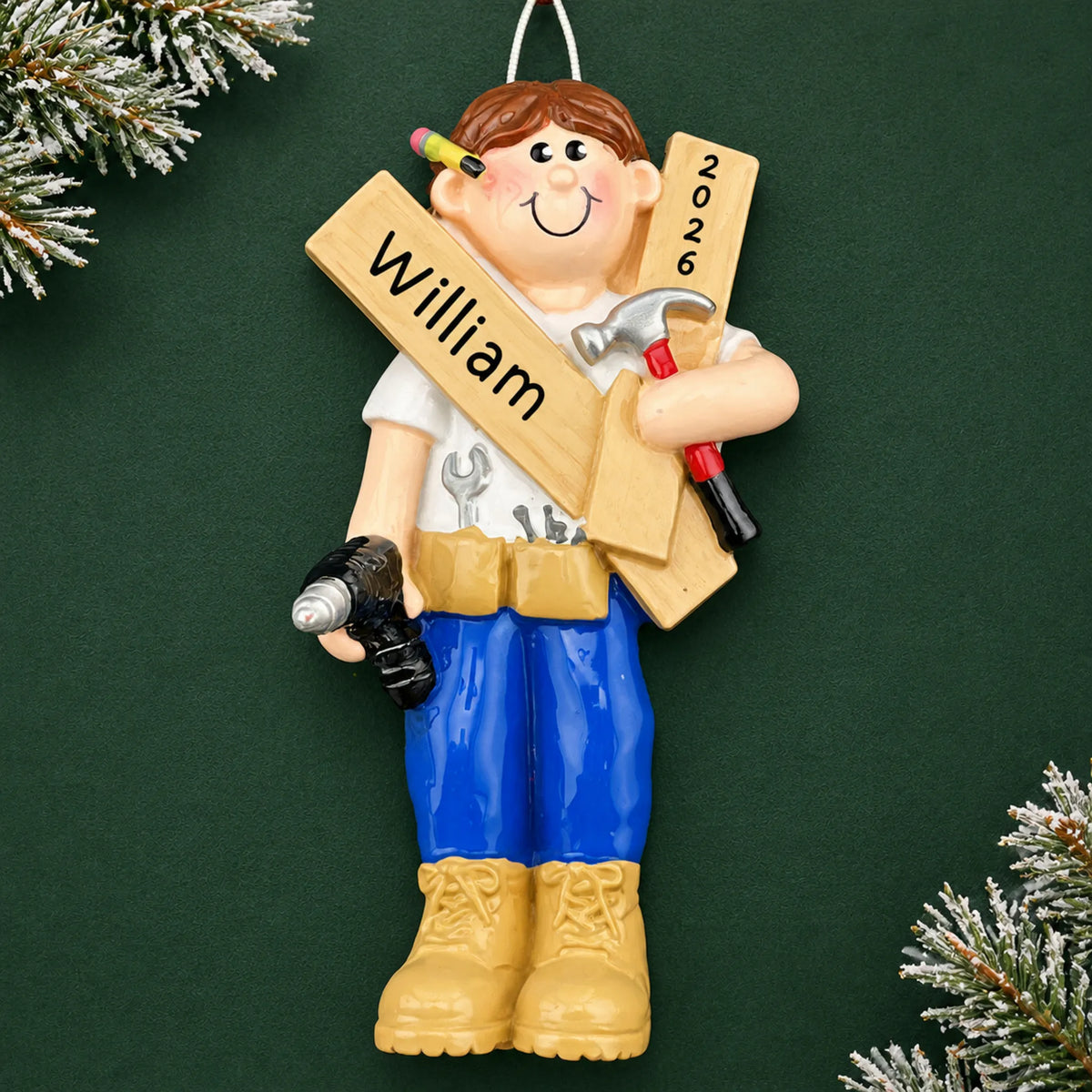 Personalized Mr. Fix It contractor christmas ornament on a dark green pine background