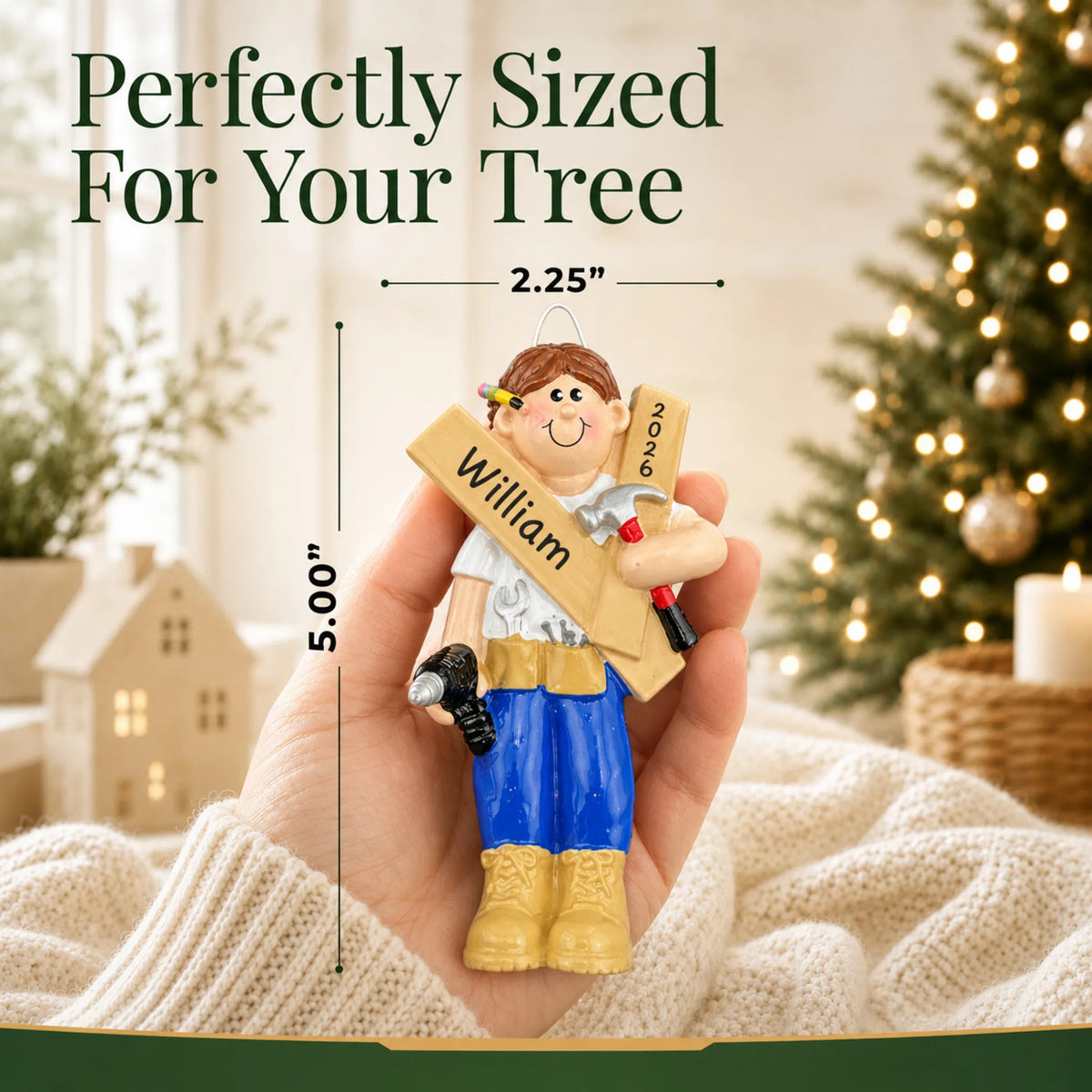 Size guide: the personalized Mr. Fix It contractor christmas ornament is 2.25 in wide by 5.00 in tall, shown in hand
