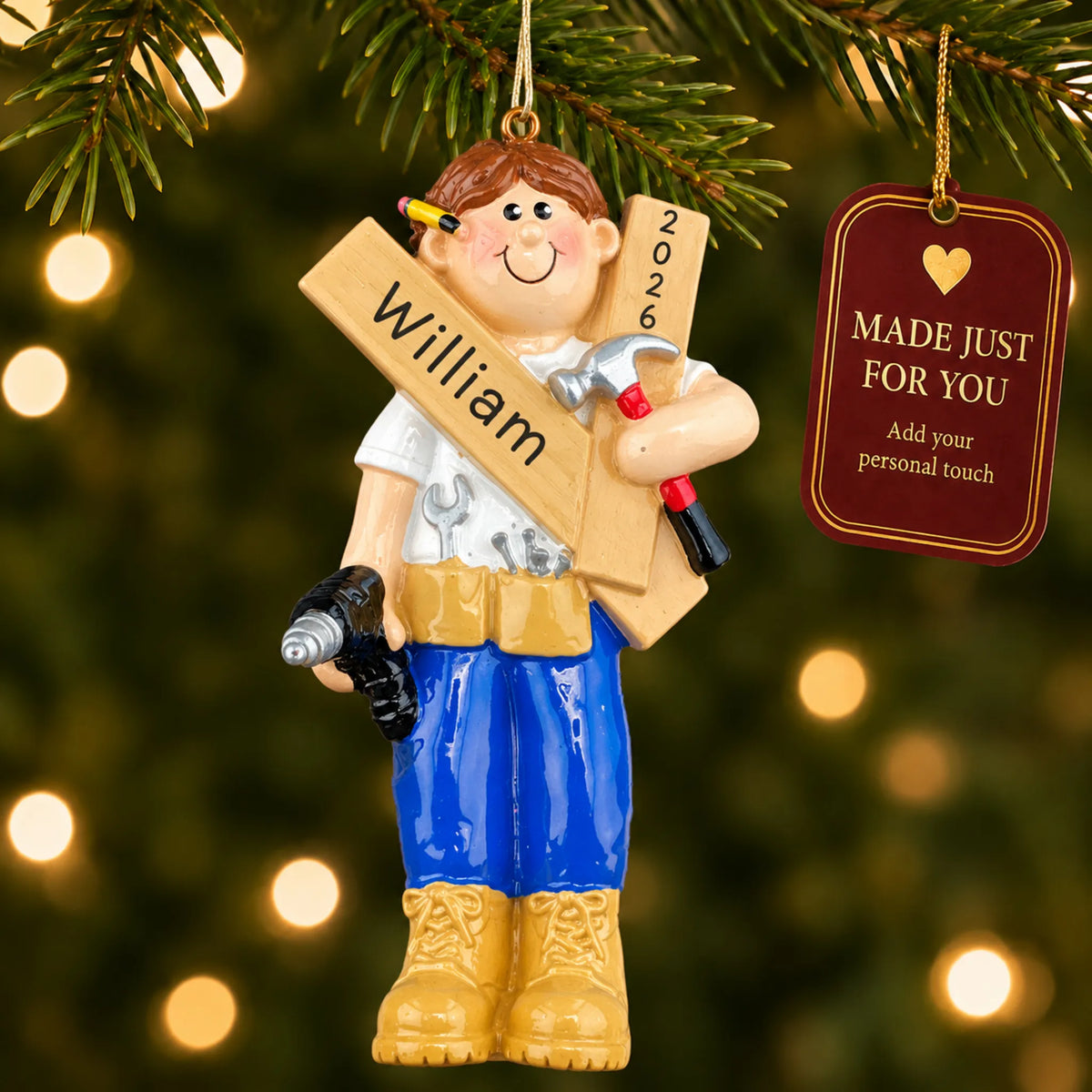 Mr. Fix It contractor christmas ornament hanging on a lit Christmas tree with a Made Just For You gift tag