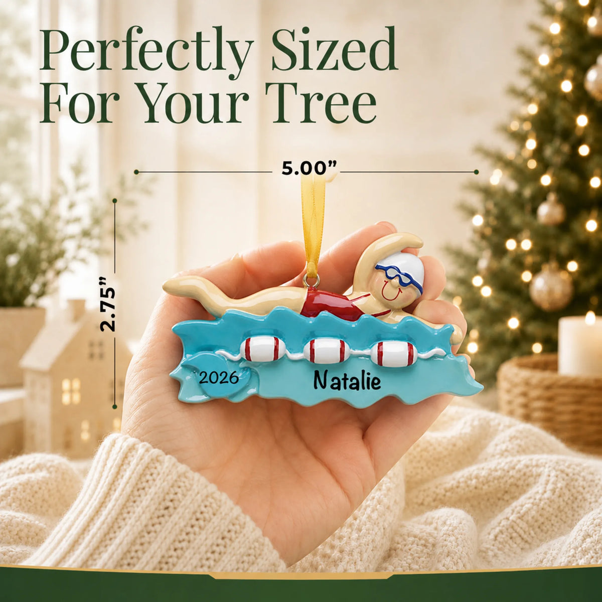 Size guide: the personalized girl swimming christmas ornament is 5.00 in wide by 2.75 in tall, shown in hand