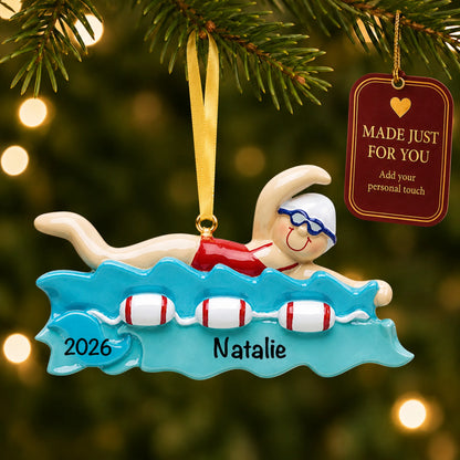 Girl swimming christmas ornament hanging on a lit Christmas tree with a Made Just For You gift tag