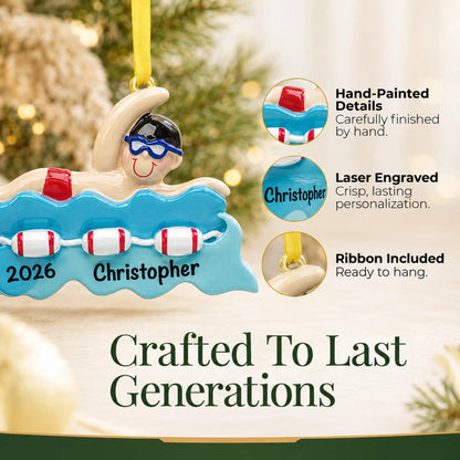 Hand-painted details and laser engraved personalization on the swim boy christmas ornament, ribbon included