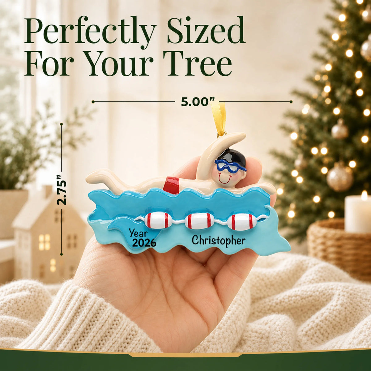 Size guide: the personalized swim boy christmas ornament shown in hand next to a Christmas tree
