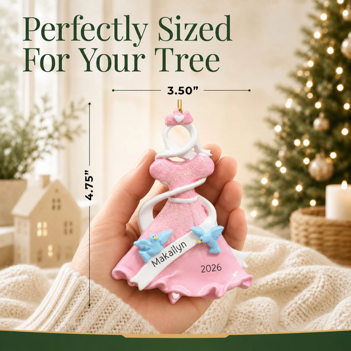 Size guide: the personalized pink princess dress christmas ornament is 3.50 in wide by 4.75 in tall, shown in hand