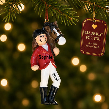 Brunette horse riding girl christmas ornament hanging on a lit Christmas tree with a Made Just For You gift tag