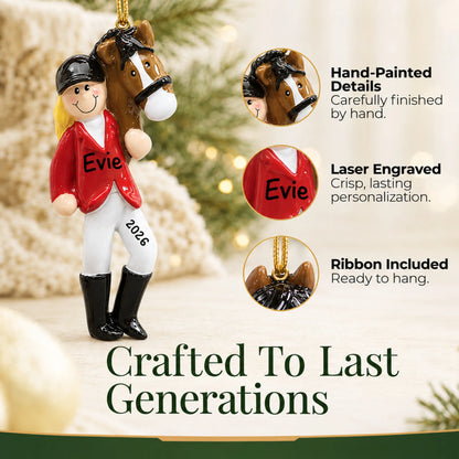 Hand-painted details and laser engraved personalization on the blonde horse riding girl christmas ornament, ribbon included