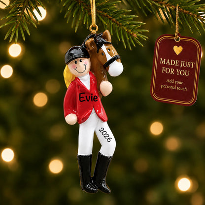Blonde horse riding girl christmas ornament hanging on a lit Christmas tree with a Made Just For You gift tag