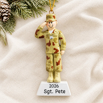 Personalized Army soldier Christmas ornament shown on a soft white blanket