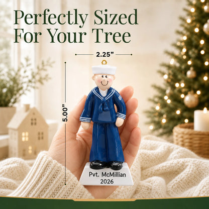 Personalized Navy sailor Christmas ornament held in hand to show its size on the tree