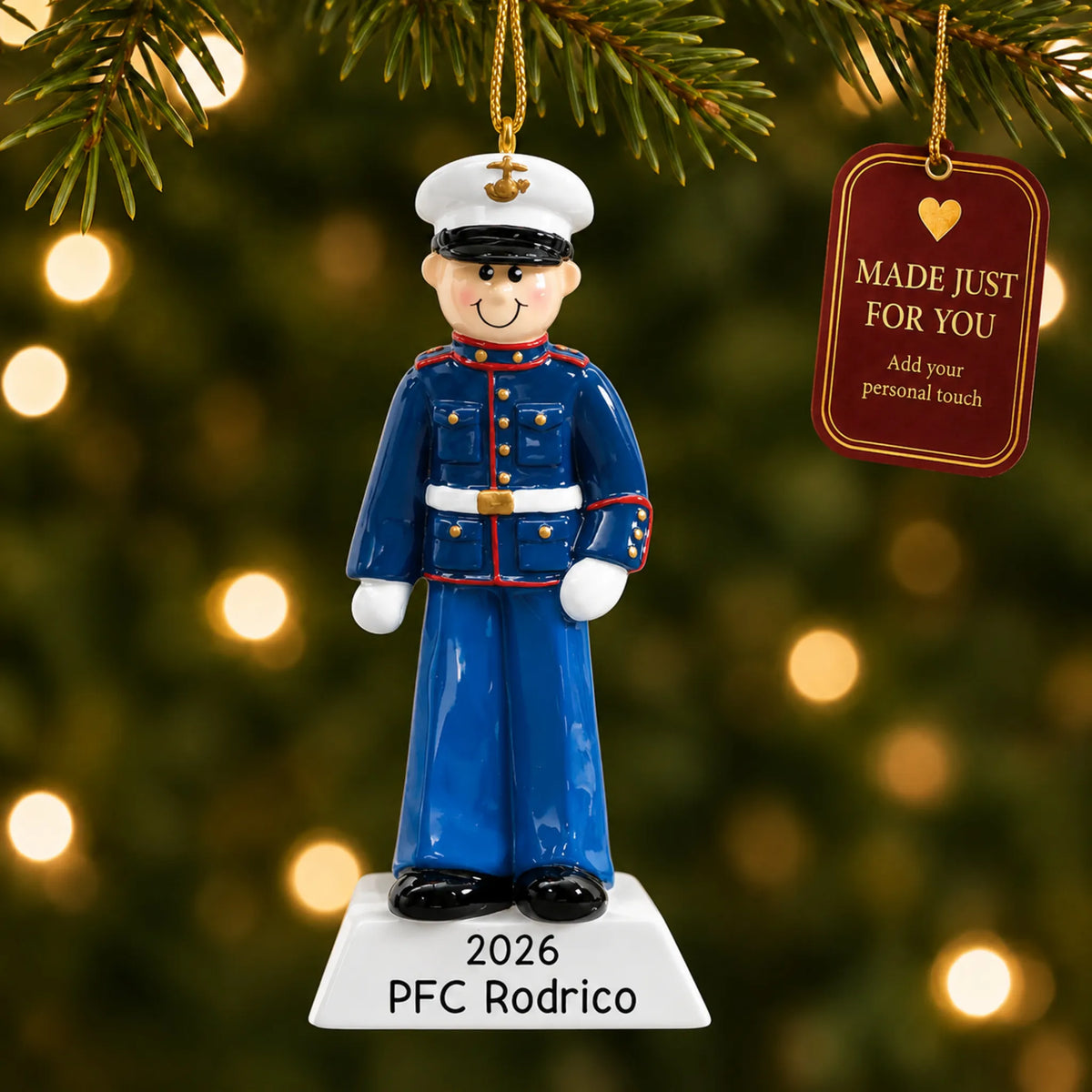 Personalized US Marine Christmas ornament hanging among tree lights with a Made Just For You tag