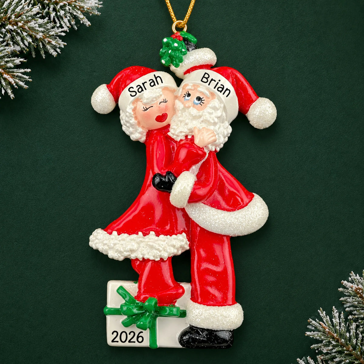 Personalized mr. and mrs. claus couple christmas ornament on a dark green pine background