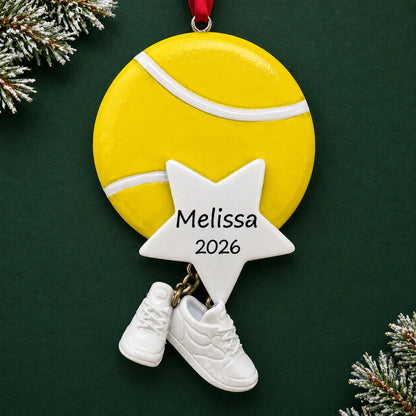 Personalized tennis star christmas ornament on a dark green pine background