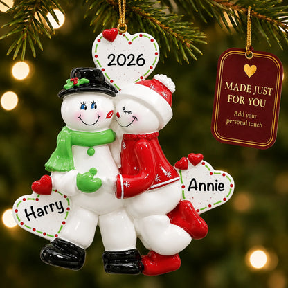 Snow sweethearts couple christmas ornament hanging on a lit Christmas tree with a Made Just For You gift tag