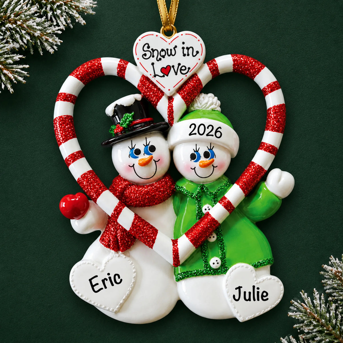 Personalized candy cane love couple christmas ornament on a dark green pine background