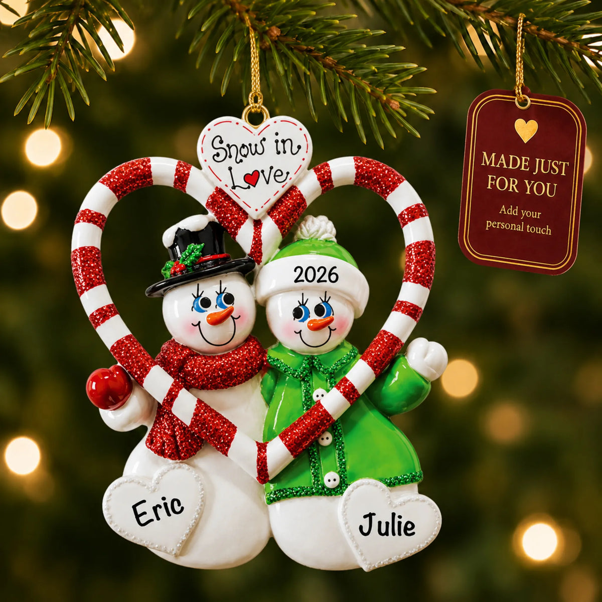 Candy cane love couple christmas ornament hanging on a lit Christmas tree with a Made Just For You gift tag