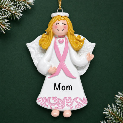 Personalized Pink Ribbon Angel christmas ornament on a dark green pine background