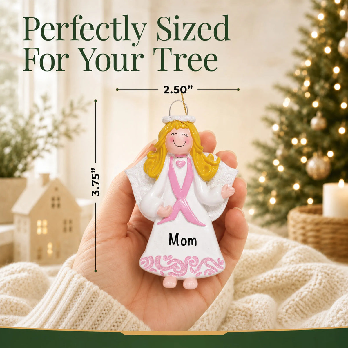 Size guide: the personalized Pink Ribbon Angel christmas ornament is 2.50 in wide by 3.75 in tall, shown in hand